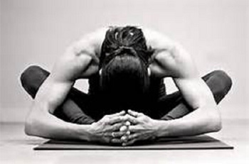 woman demonstrating a flexible yoga pose.